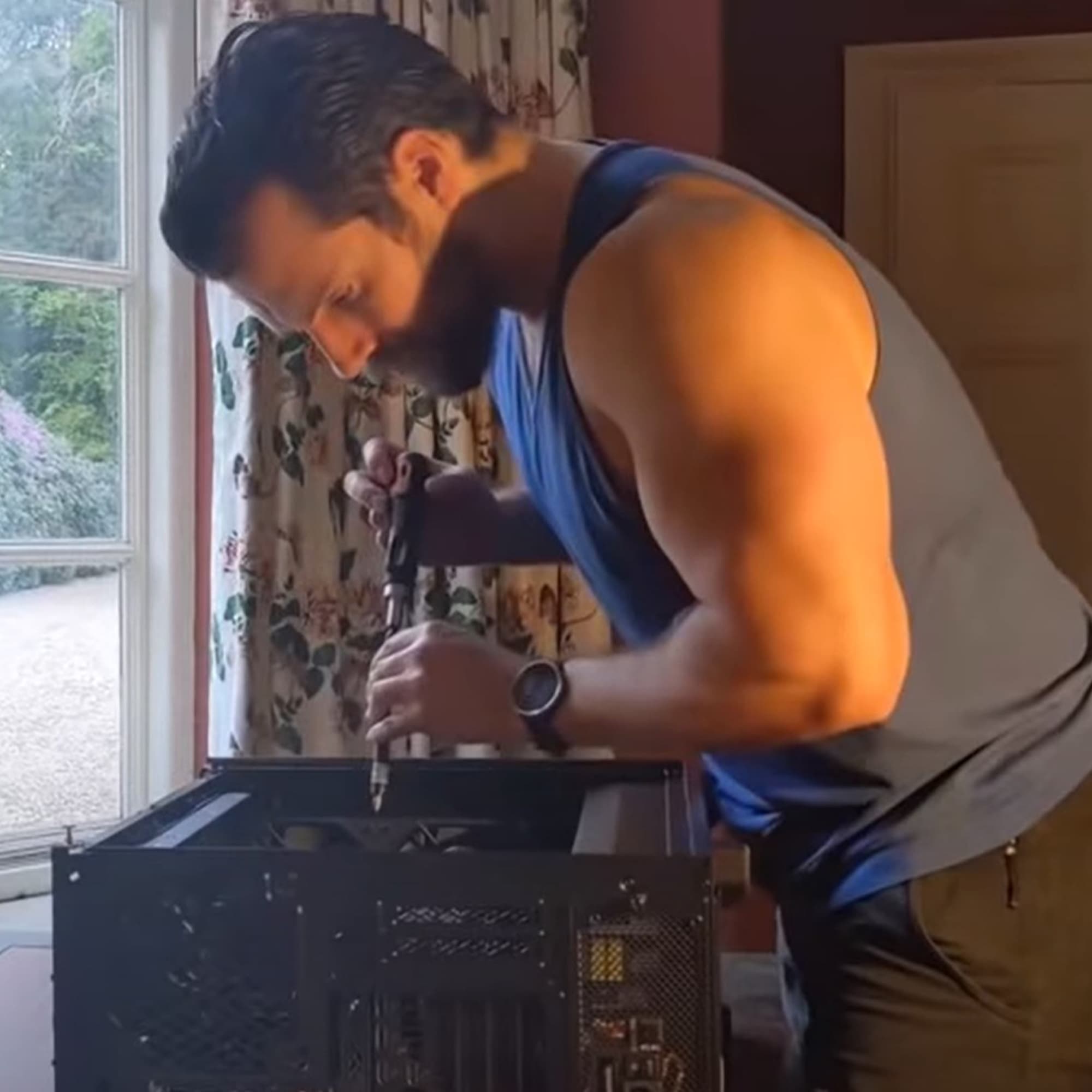 Because you definitely want to watch Henry Cavill build a gaming