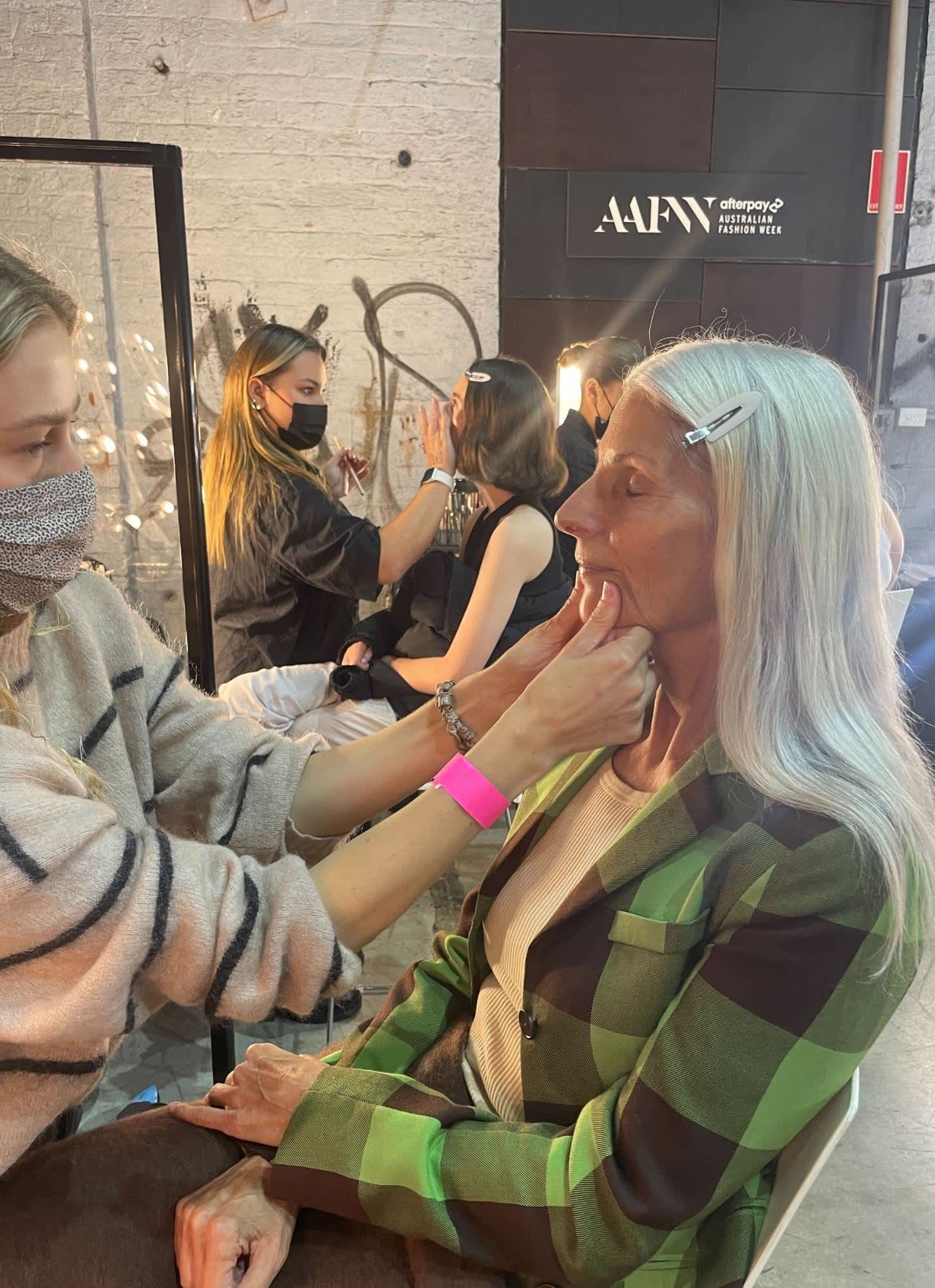 Facial massage backstage at Gary Bigeni
