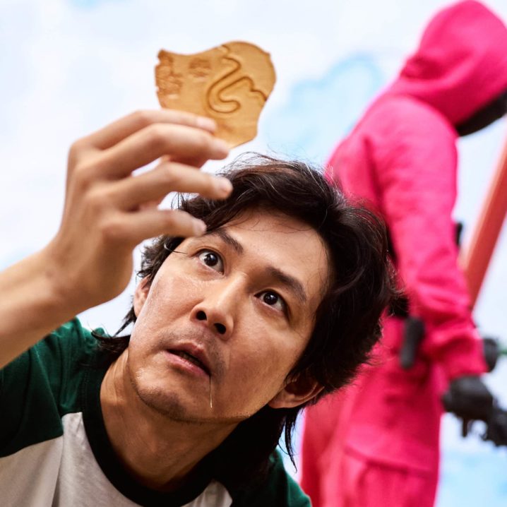 Lee Jung-jae as Seong Gi-hun during the dalgona candy challenge in Netflix's Squid Game.