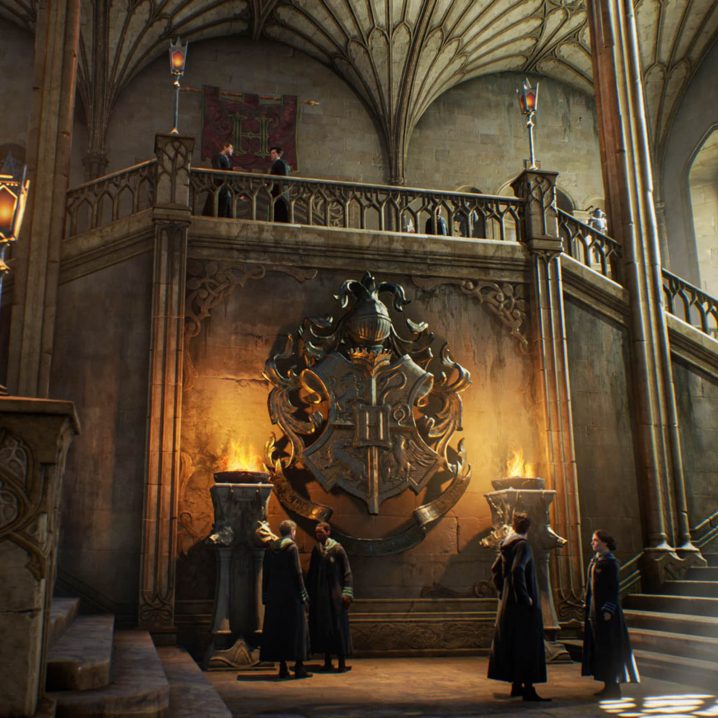 Students on the castle staircase in Hogwarts Legacy.