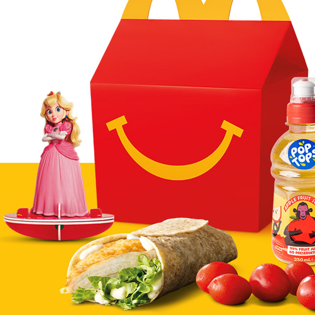 Close-up of the Super Mario Bros Movie Happy Meal with the Princess Peach toy.