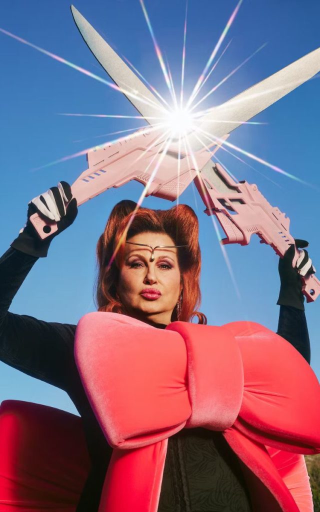 Jennifer Coolidge with red hair and superhero vibes for W Magazine