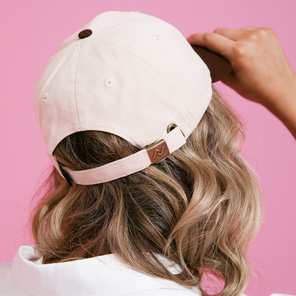 rollie nation x barbie white cap on blonde woman