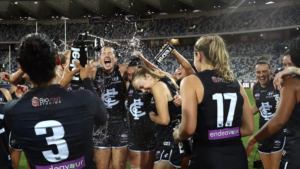 AFLW Players celebrating a win